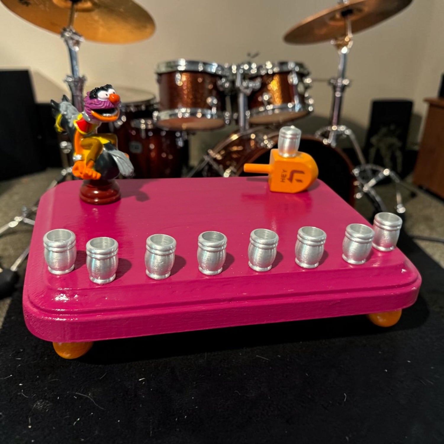 Animal Muppets menorah — wild-haired drummer chess figure above aluminum candle cups | Judaica Square Lakewood (view 9)