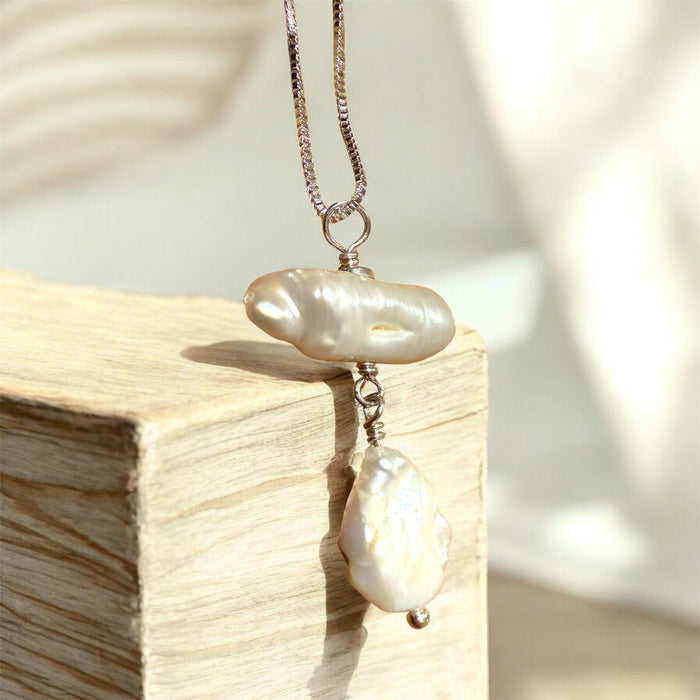 Freshwater pearl dangling in sterling silver wire on a box chain | Judaica Square Lakewood