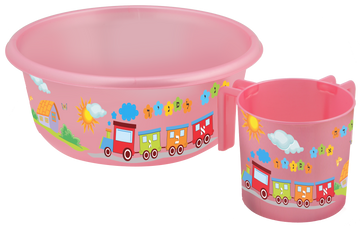 Pink washing basin and matching cup for children, decorated with a lettered train, sun and cottage