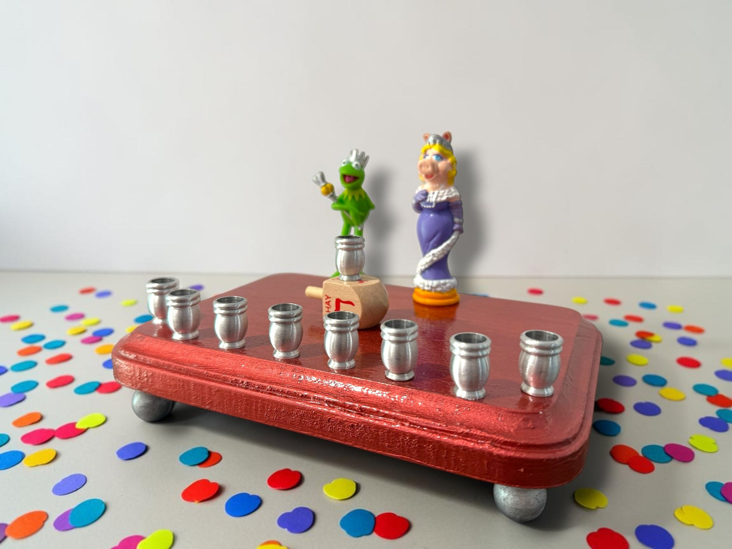 Kermit and Miss Piggy menorah — Muppets chess figures on a small painted plaque | Judaica Square Lakewood (view 3)