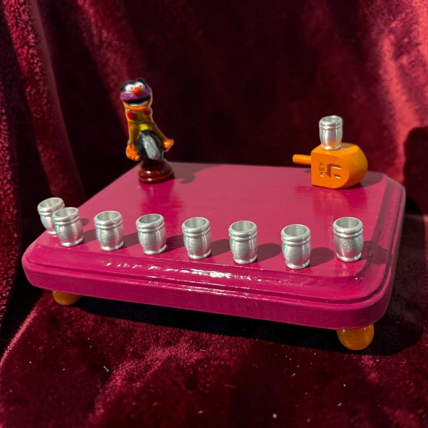 Animal Muppets menorah — wild-haired drummer chess figure above aluminum candle cups | Judaica Square Lakewood (view 13)