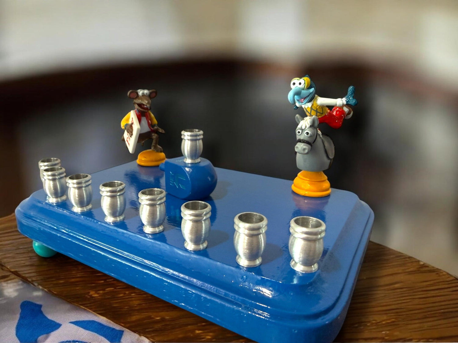 Gonzo and Ralph menorah — two Muppets chess figures sharing a painted wood plaque | Judaica Square Lakewood (view 8)