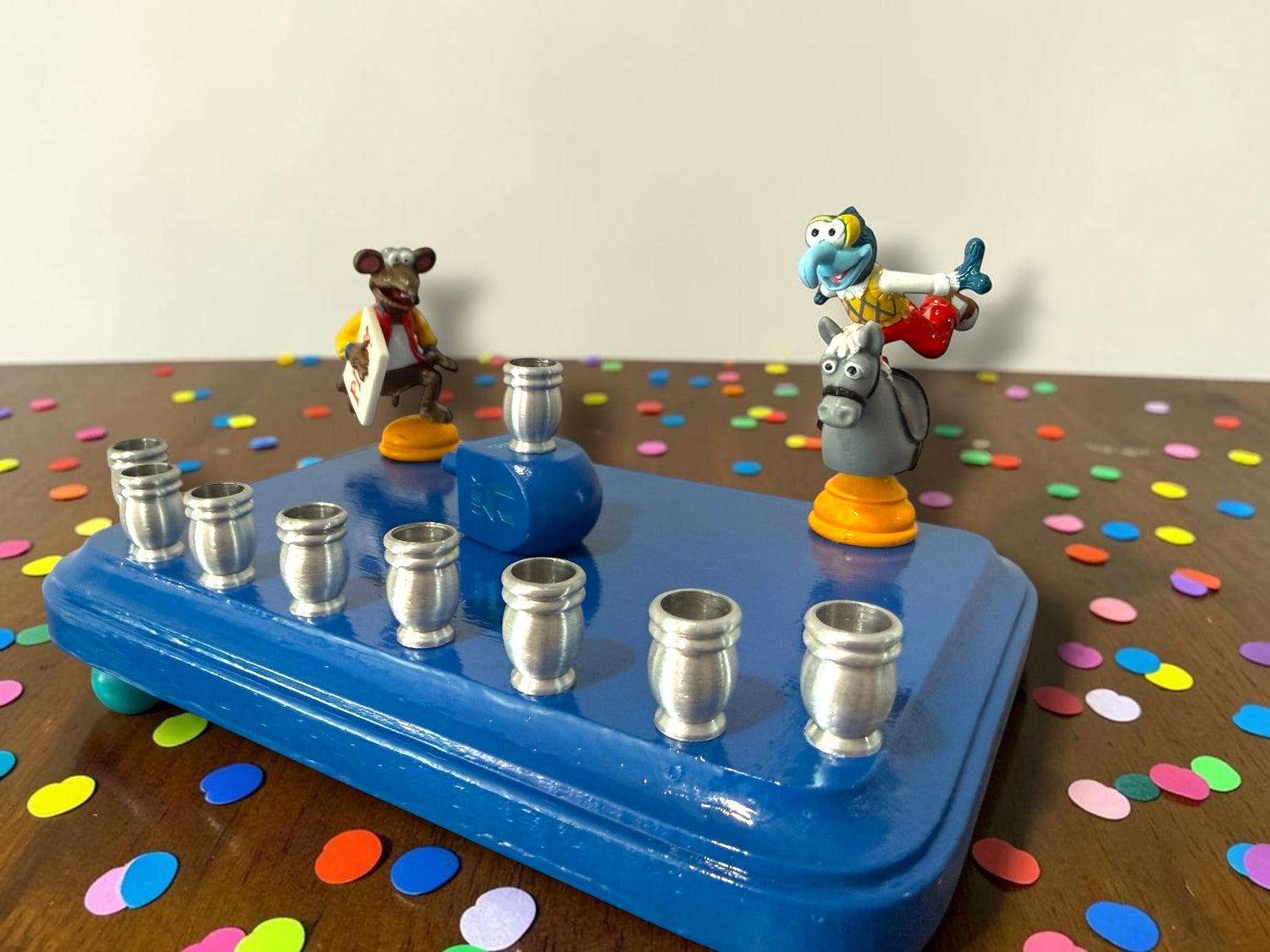 Gonzo and Ralph menorah — two Muppets chess figures sharing a painted wood plaque | Judaica Square Lakewood (view 5)