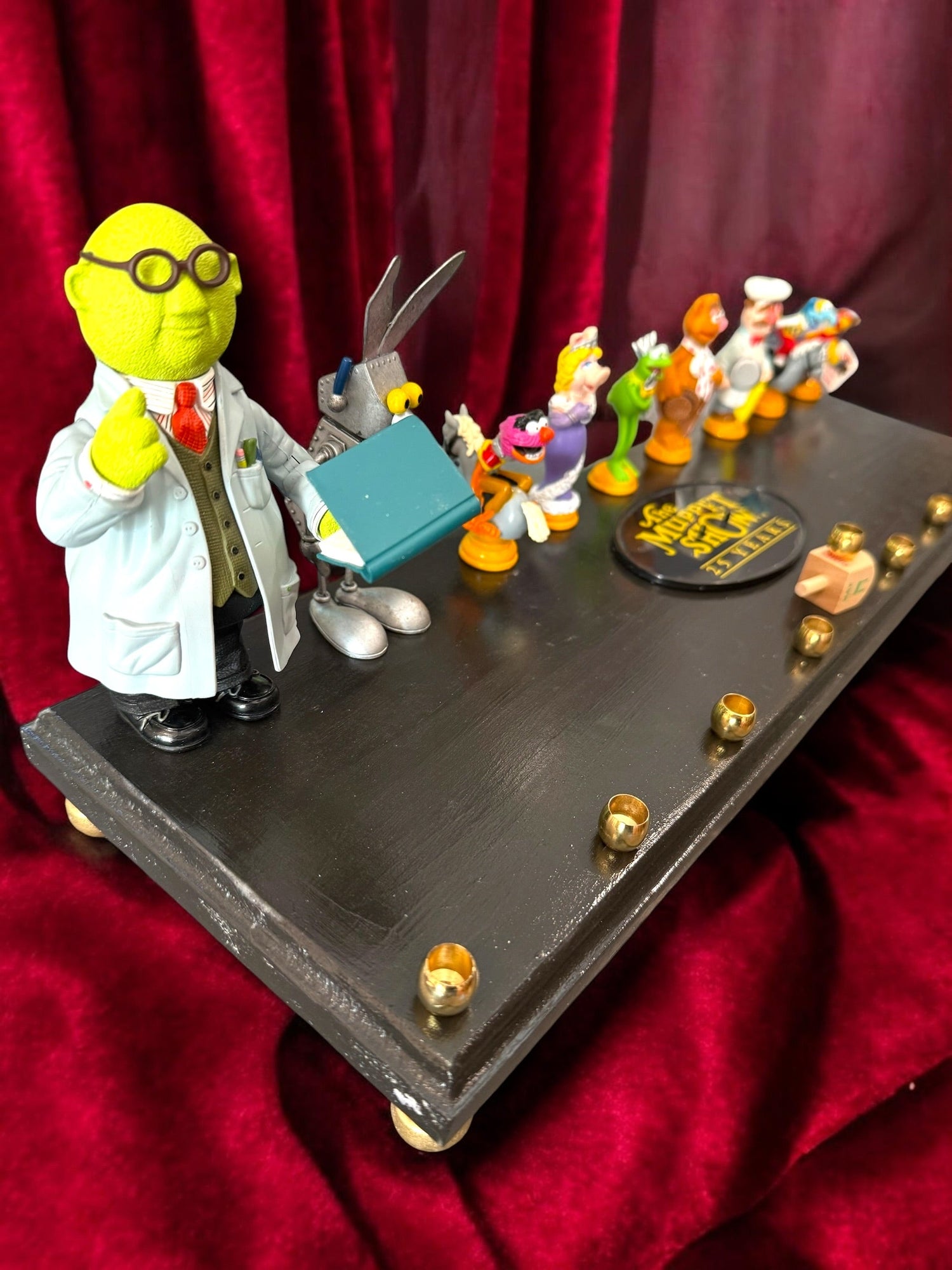 Muppets cast menorah — nine repurposed Muppets figures along a long plaque with brass cups | Judaica Square Lakewoo (view 30)