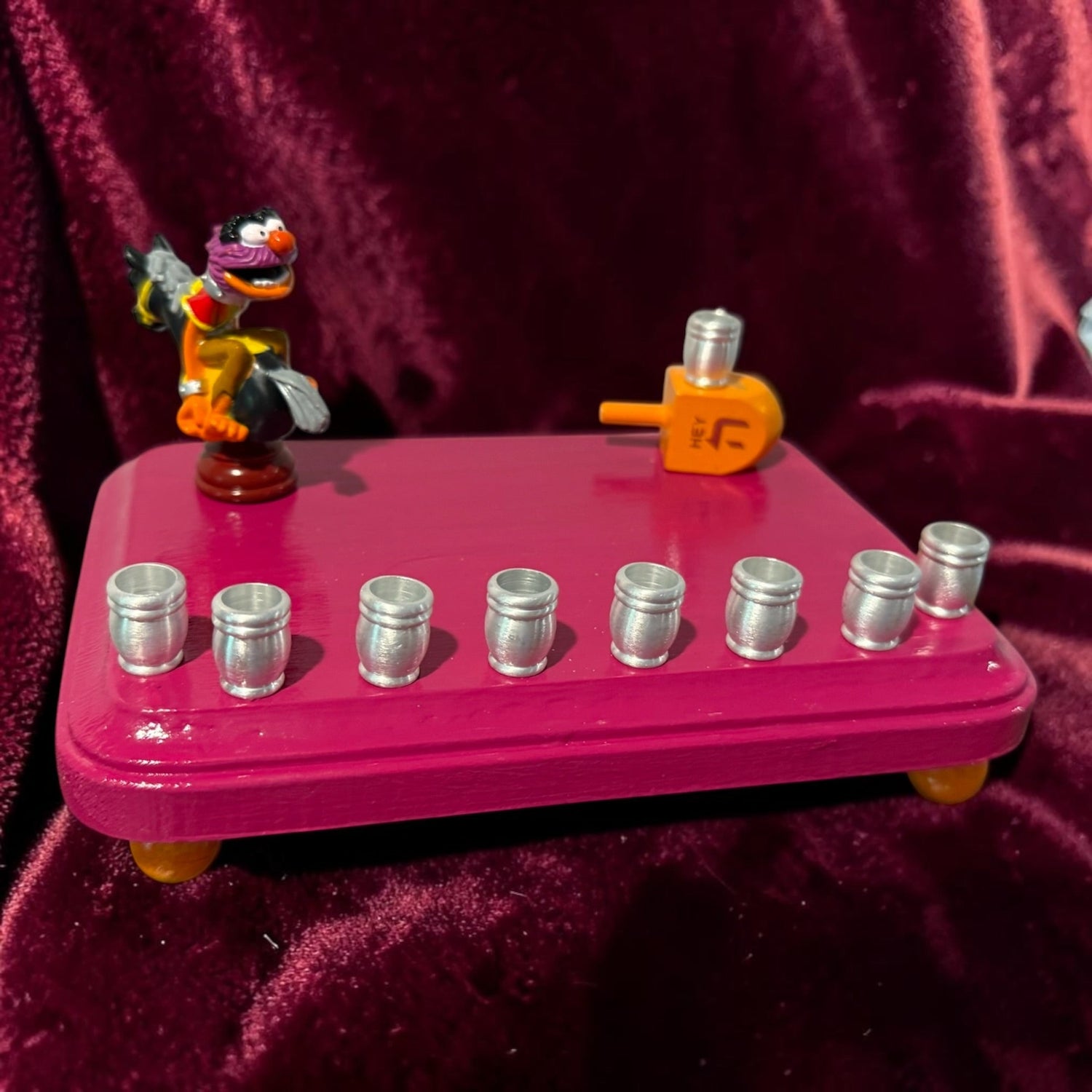 Animal Muppets menorah — wild-haired drummer chess figure above aluminum candle cups | Judaica Square Lakewood (view 12)