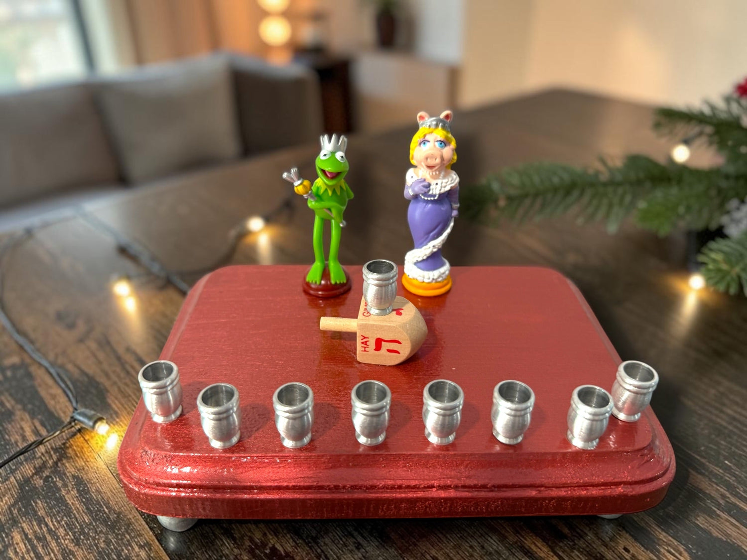 Kermit and Miss Piggy menorah — Muppets chess figures on a small painted plaque | Judaica Square Lakewood (view 2)
