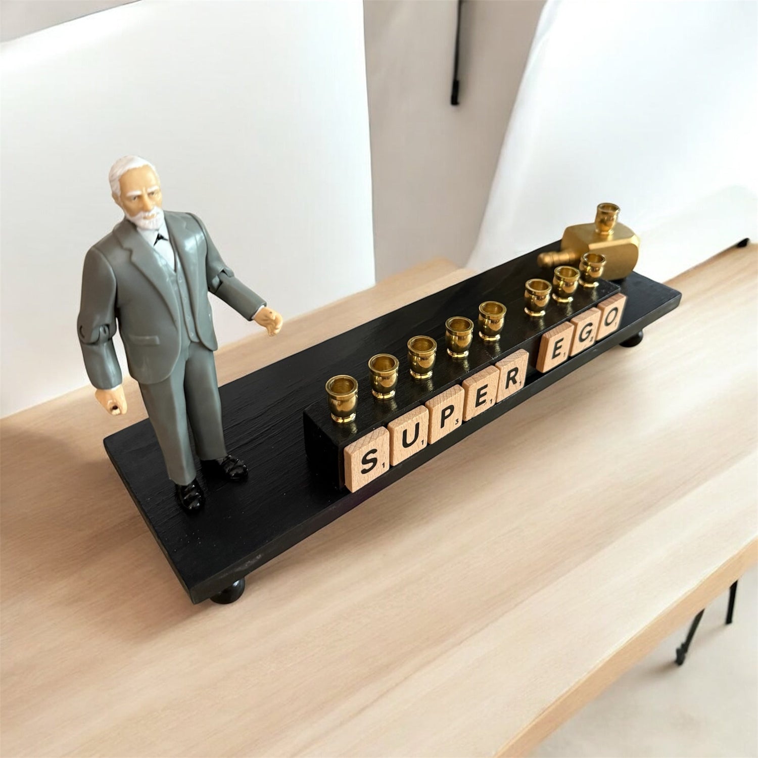 Sigmund Freud Menorah — Freud figure with SUPEREGO letter tiles and gold cups | Judaica Square Lakewood (view 2)
