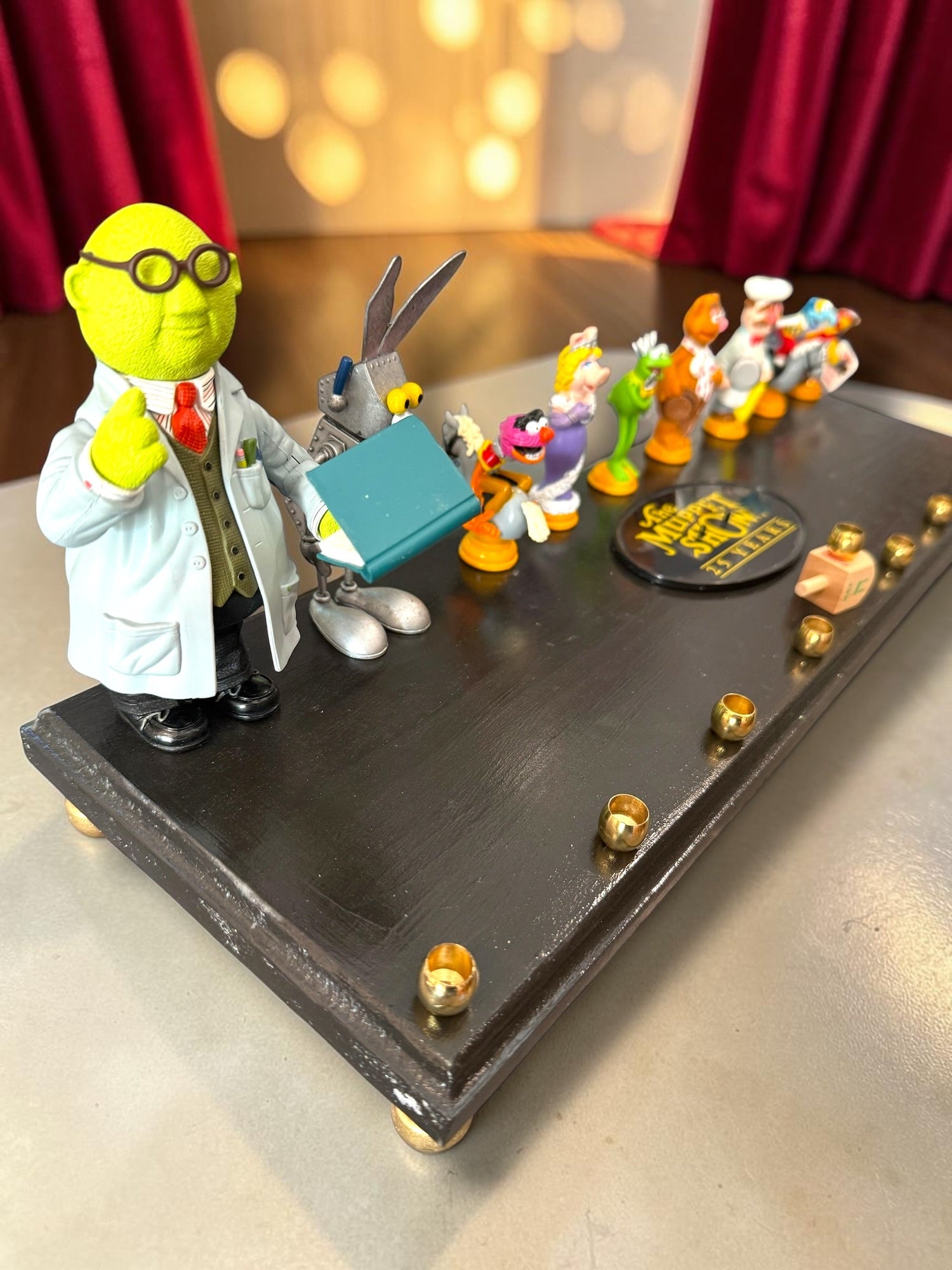 Muppets cast menorah — nine repurposed Muppets figures along a long plaque with brass cups | Judaica Square Lakewoo (view 10)