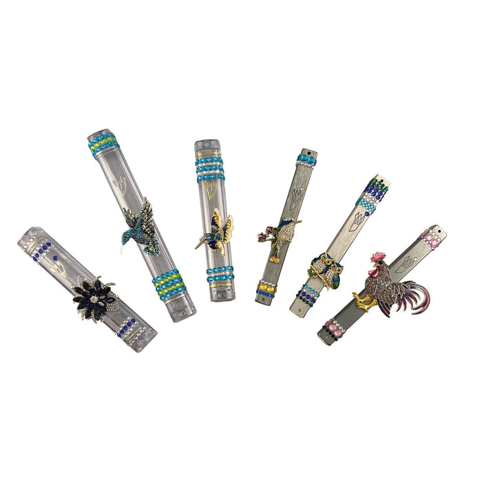 Flying bling mezuzah case — winged enamel accents and rhinestones on clear acrylic | Judaica Square Lakewood