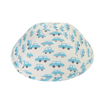 Ivory cotton boys kippah printed all over with small sky-blue cars with dark wheels, the print continuing onto the rim