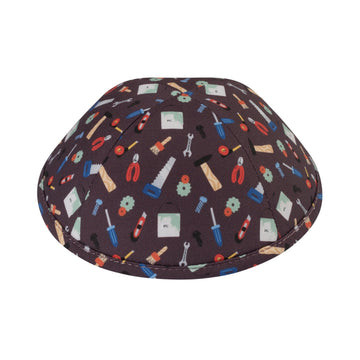 Dark brown cotton boys kippah printed all over with wrenches, pliers, saws, screwdrivers, hammers and paint brushes