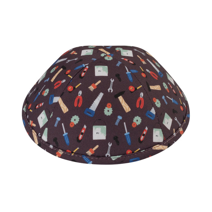 Dark brown cotton boys kippah printed all over with wrenches, pliers, saws, screwdrivers, hammers and paint brushes