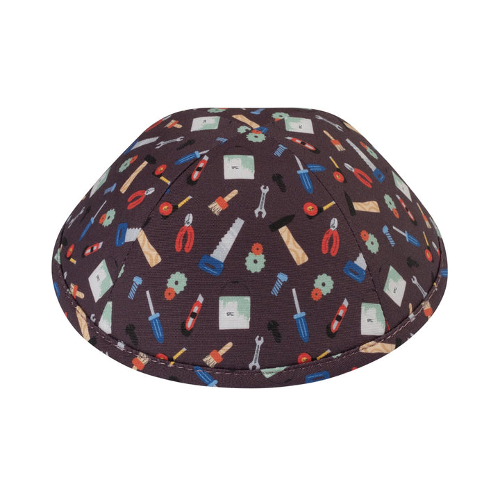 Dark brown cotton boys kippah printed all over with wrenches, pliers, saws, screwdrivers, hammers and paint brushes