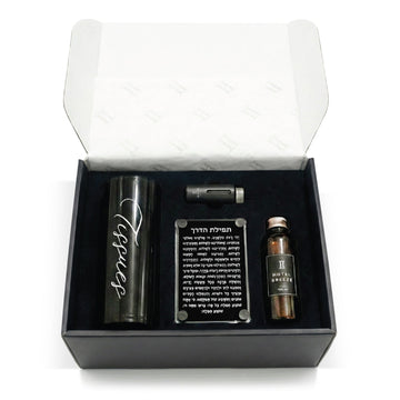Open black gift box holding the tissue cylinder, diffuser, Tefilas Haderech plaque and oil refill