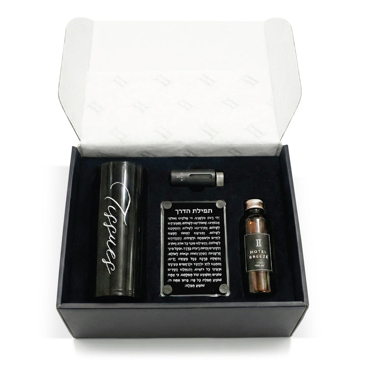 Open black gift box holding the tissue cylinder, diffuser, Tefilas Haderech plaque and oil refill