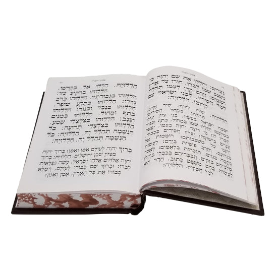 Open pages of the medium Sefard complete siddur, leatherette, showing the Hebrew text layout