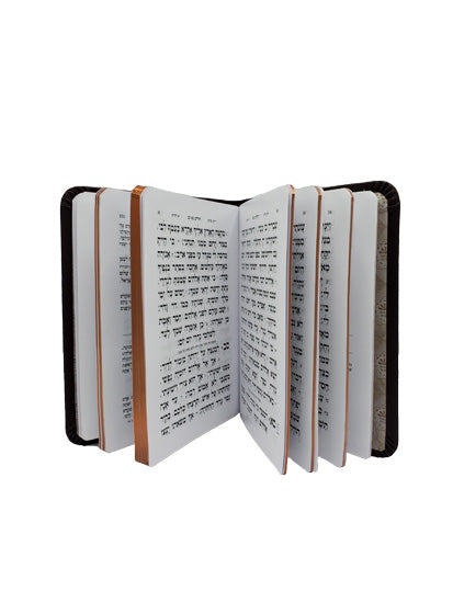 Open pages of the Sefard Tehillim, Little Marcel hardcover, showing the Hebrew text layout