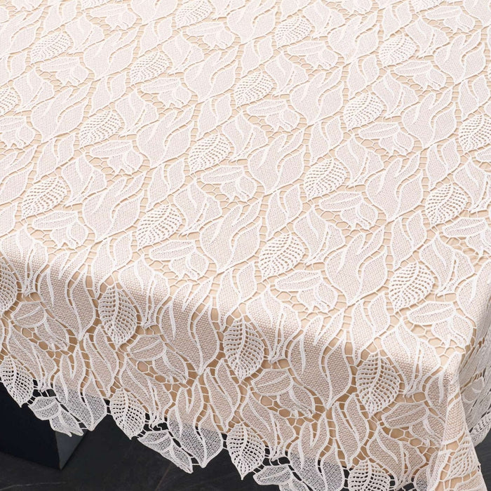 Leaf Lace Tablecloth — white leaf-patterned lace tablecloth on a set table linens | Judaica Square Lakewood