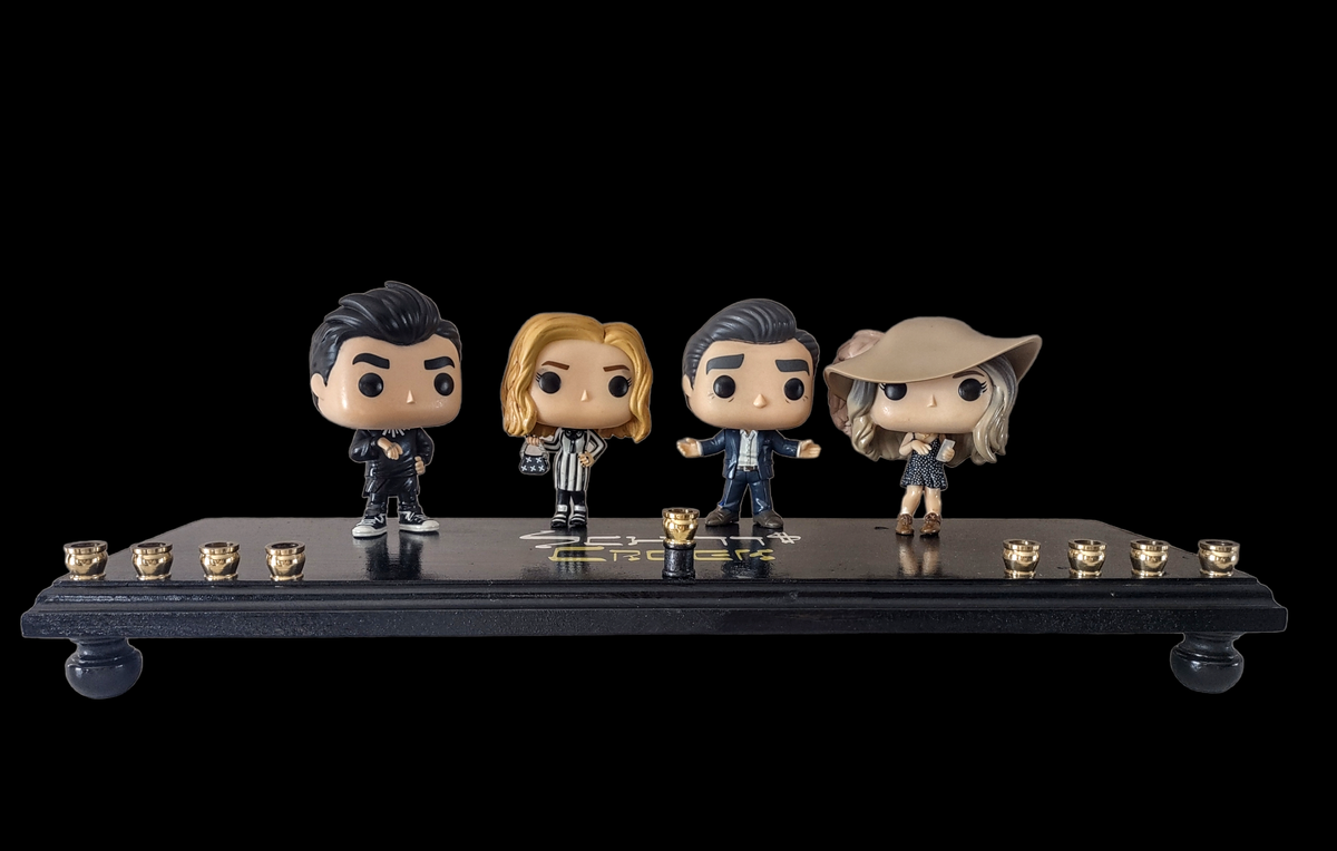 Schitt's Creek Menorah — Rose family collector figures along a 24-inch wood plaque | Judaica Square Lakewood (view 2)
