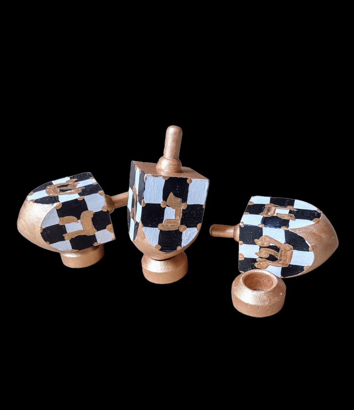 Checkerboard Dreidel — black, white and gold checkered wood dreidel | Judaica Square Lakewood