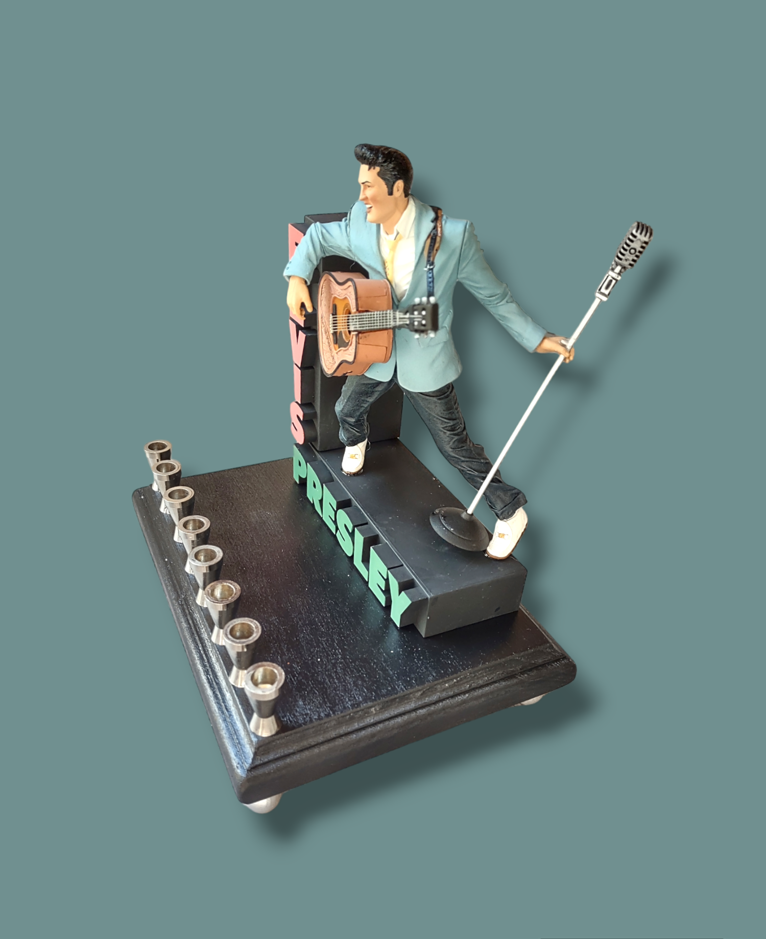 Elvis marquee menorah — King figure at the mic under a stacked name marquee | Judaica Square Lakewood (view 7)