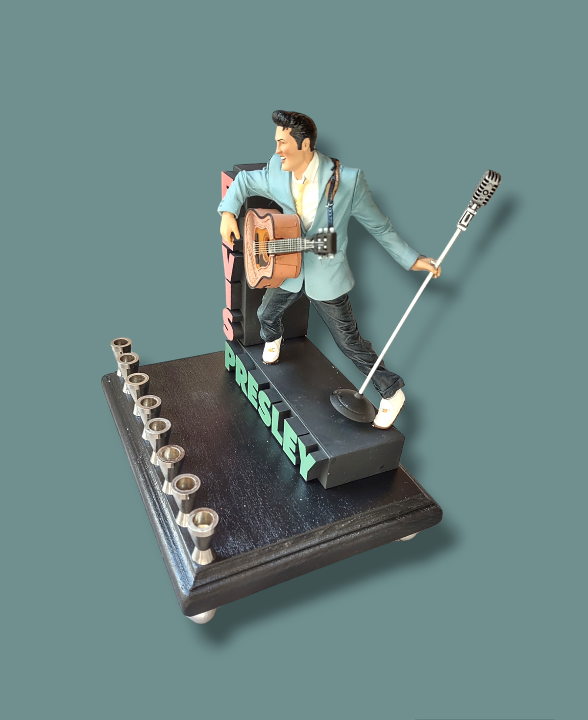 Elvis marquee menorah — King figure at the mic under a stacked name marquee | Judaica Square Lakewood (view 7)