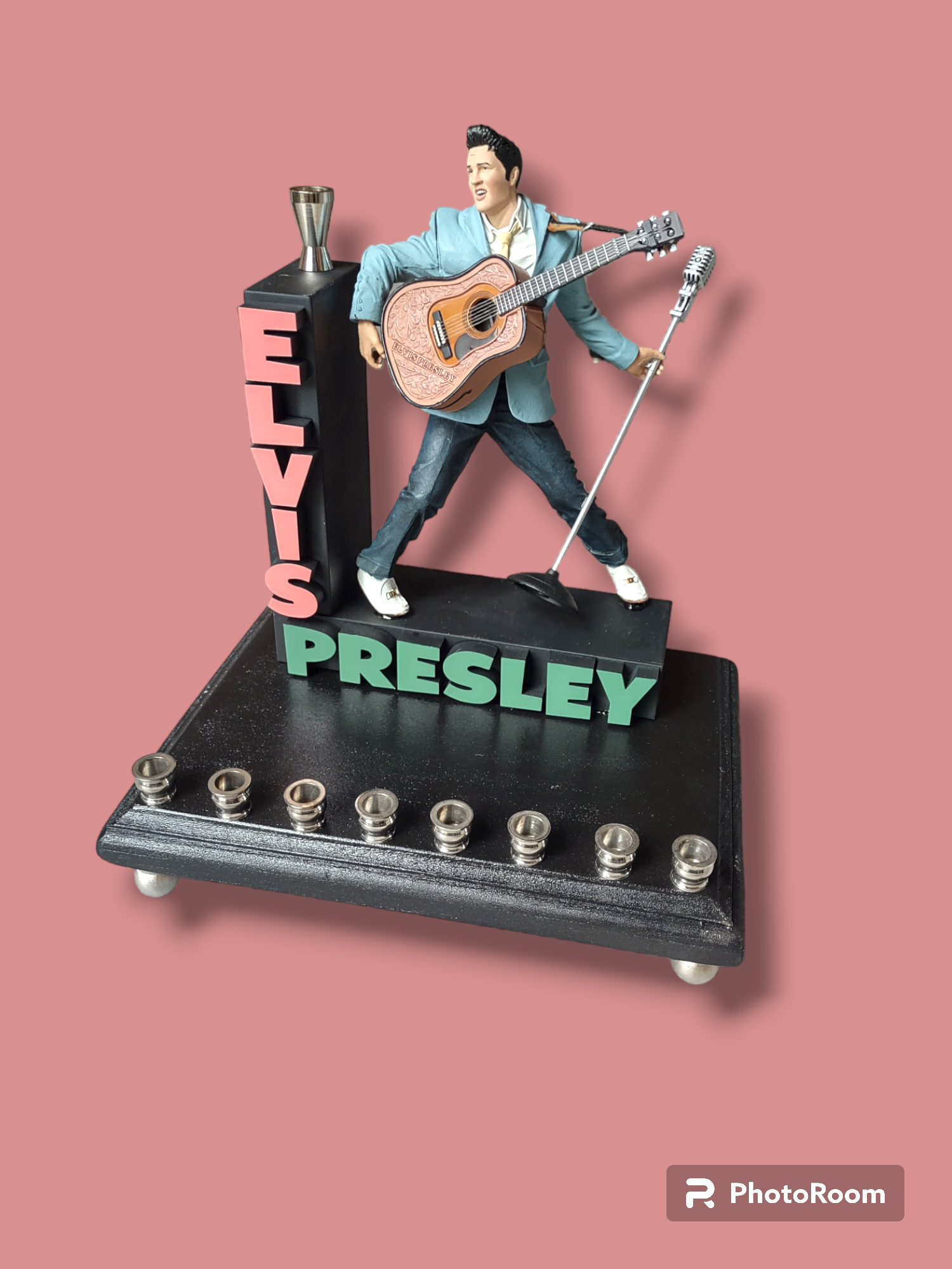 Elvis marquee menorah — King figure at the mic under a stacked name marquee | Judaica Square Lakewood (view 3)