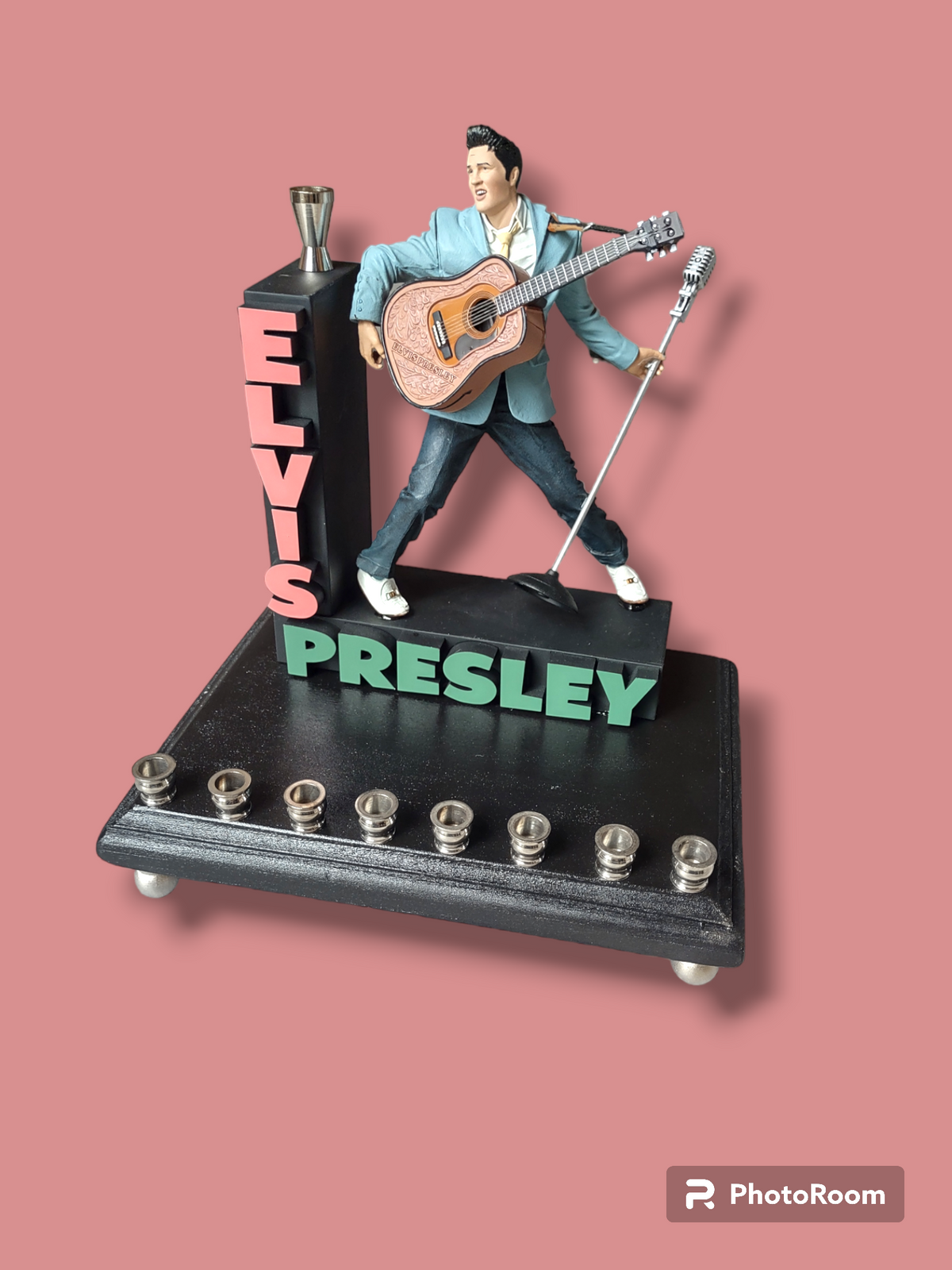 Elvis marquee menorah — King figure at the mic under a stacked name marquee | Judaica Square Lakewood (view 3)