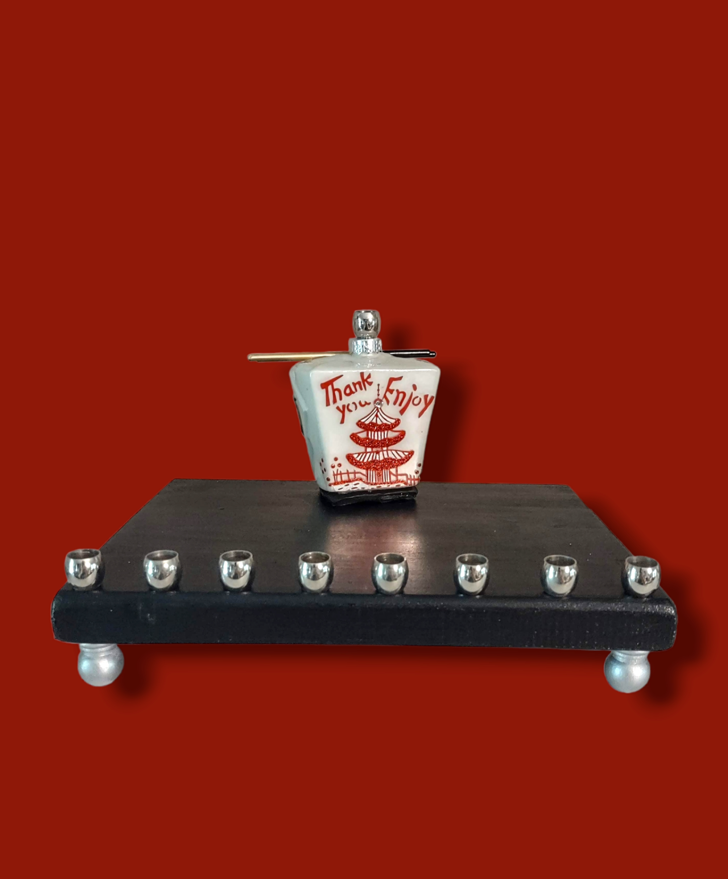 Chinese take-out menorah — glass take-out carton on painted wood with brass cups | Judaica Square Lakewood (view 2)