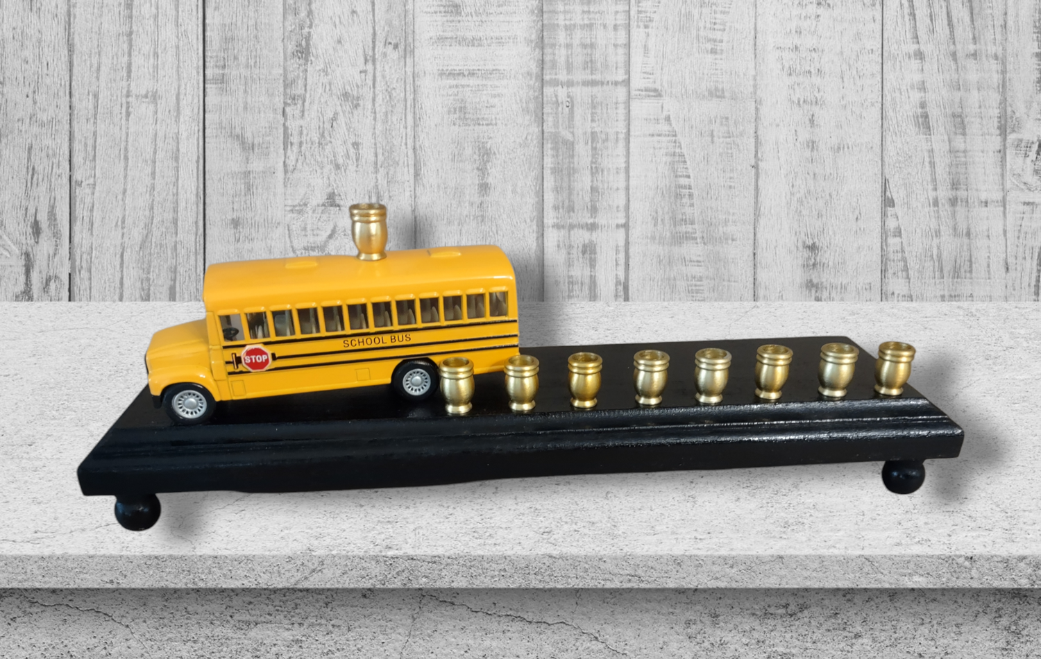 School Bus Menorah — yellow repurposed toy bus fitted with aluminum candle cups | Judaica Square Lakewood (view 4)
