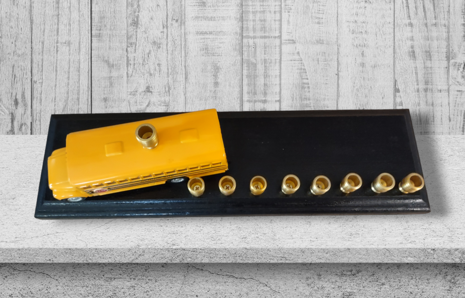 School Bus Menorah — yellow repurposed toy bus fitted with aluminum candle cups | Judaica Square Lakewood (view 3)