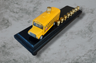 School Bus Menorah — yellow repurposed toy bus fitted with aluminum candle cups | Judaica Square Lakewood