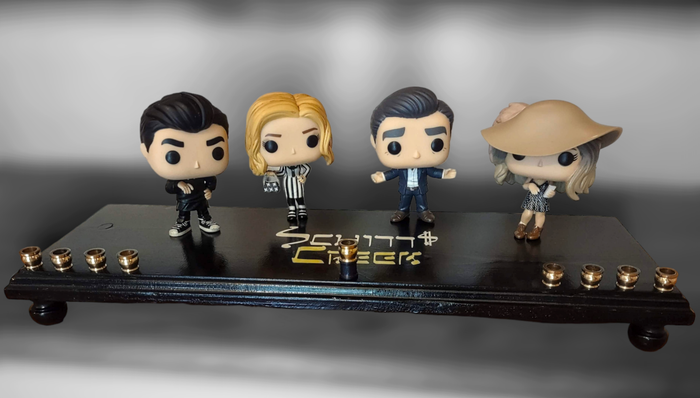 Schitt's Creek Menorah — Rose family collector figures along a 24-inch wood plaque | Judaica Square Lakewood
