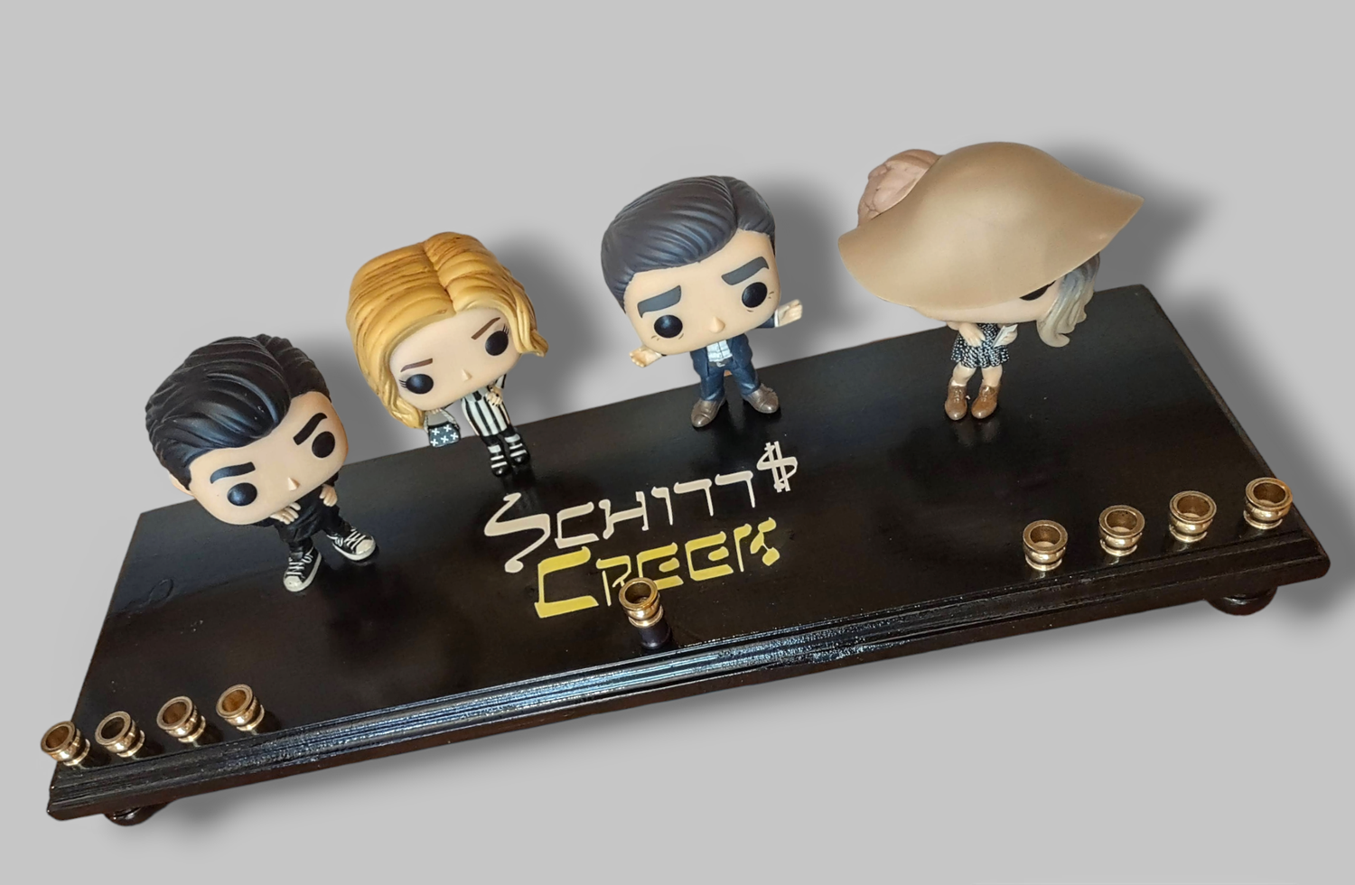 Schitt's Creek Menorah — Rose family collector figures along a 24-inch wood plaque | Judaica Square Lakewood (view 7)