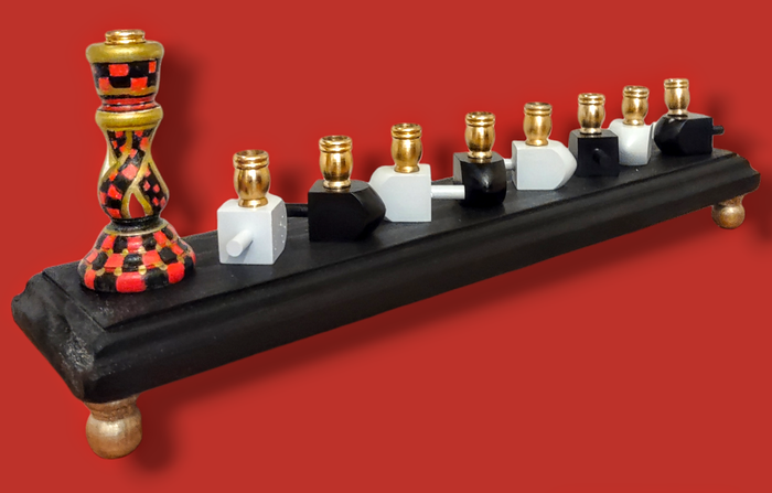 Checkerboard candlestick menorah — painted tapered holders, mini dreidels and gold feet | Judaica Square Lakewood