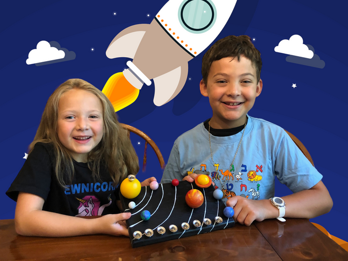 Solar system menorah kit — wooden planet pieces forming an outer space hanukkiah | Judaica Square Lakewood