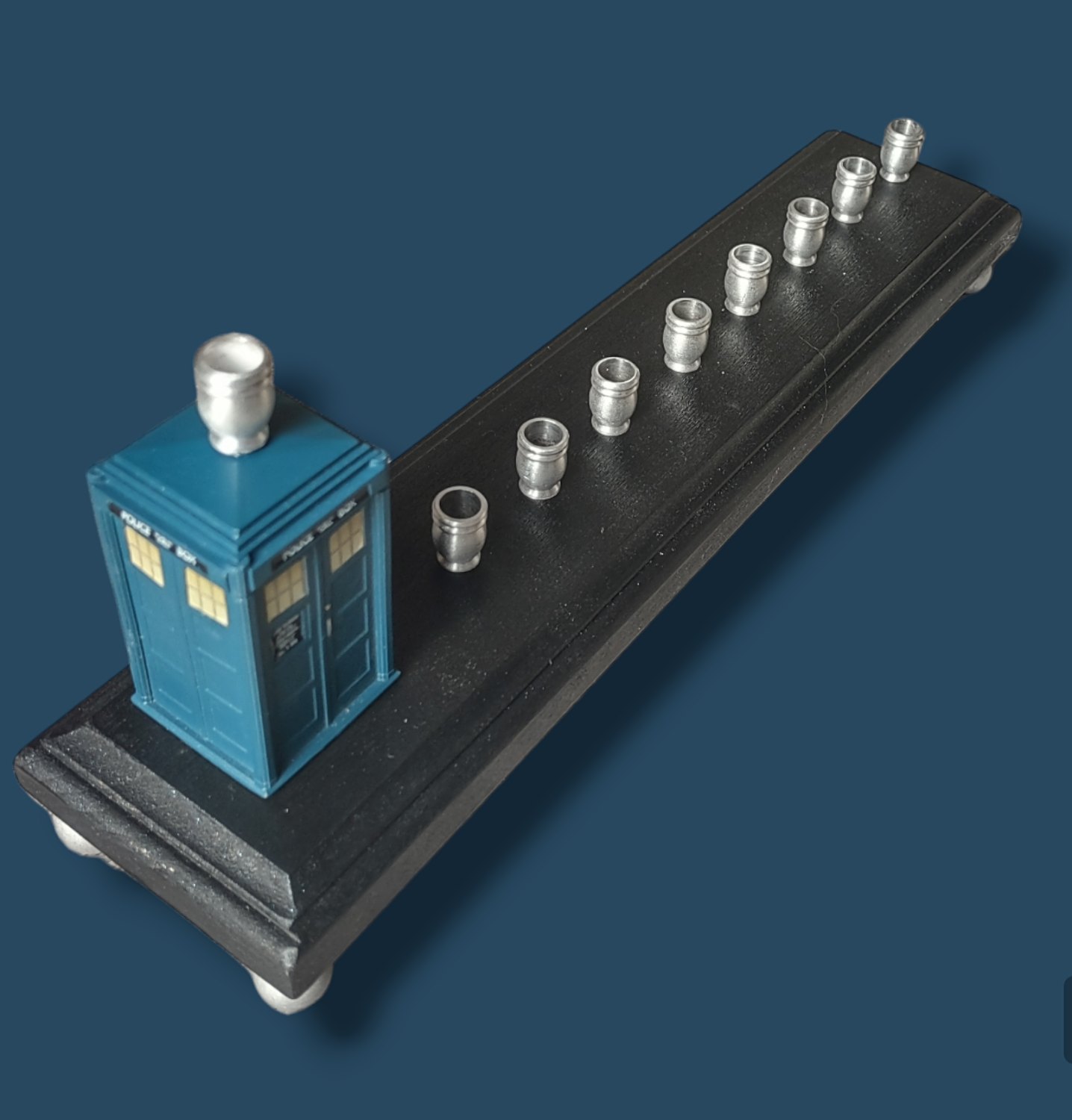 TARDIS menorah — Doctor Who time machine figure with painted wood feet | Judaica Square Lakewood (view 2)