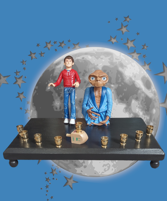 E.T. and Elliott menorah — pair of repurposed 80s toy figures with brass cups | Judaica Square Lakewood