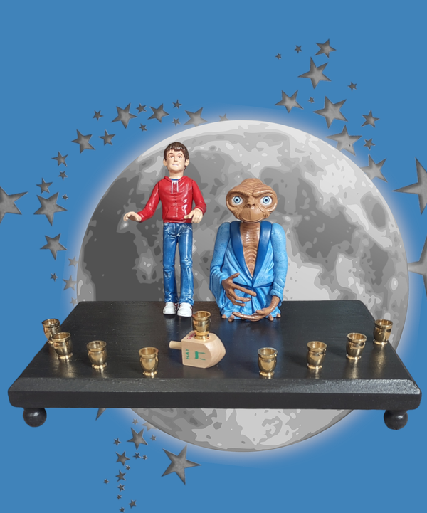 E.T. and Elliott menorah — pair of repurposed 80s toy figures with brass cups | Judaica Square Lakewood