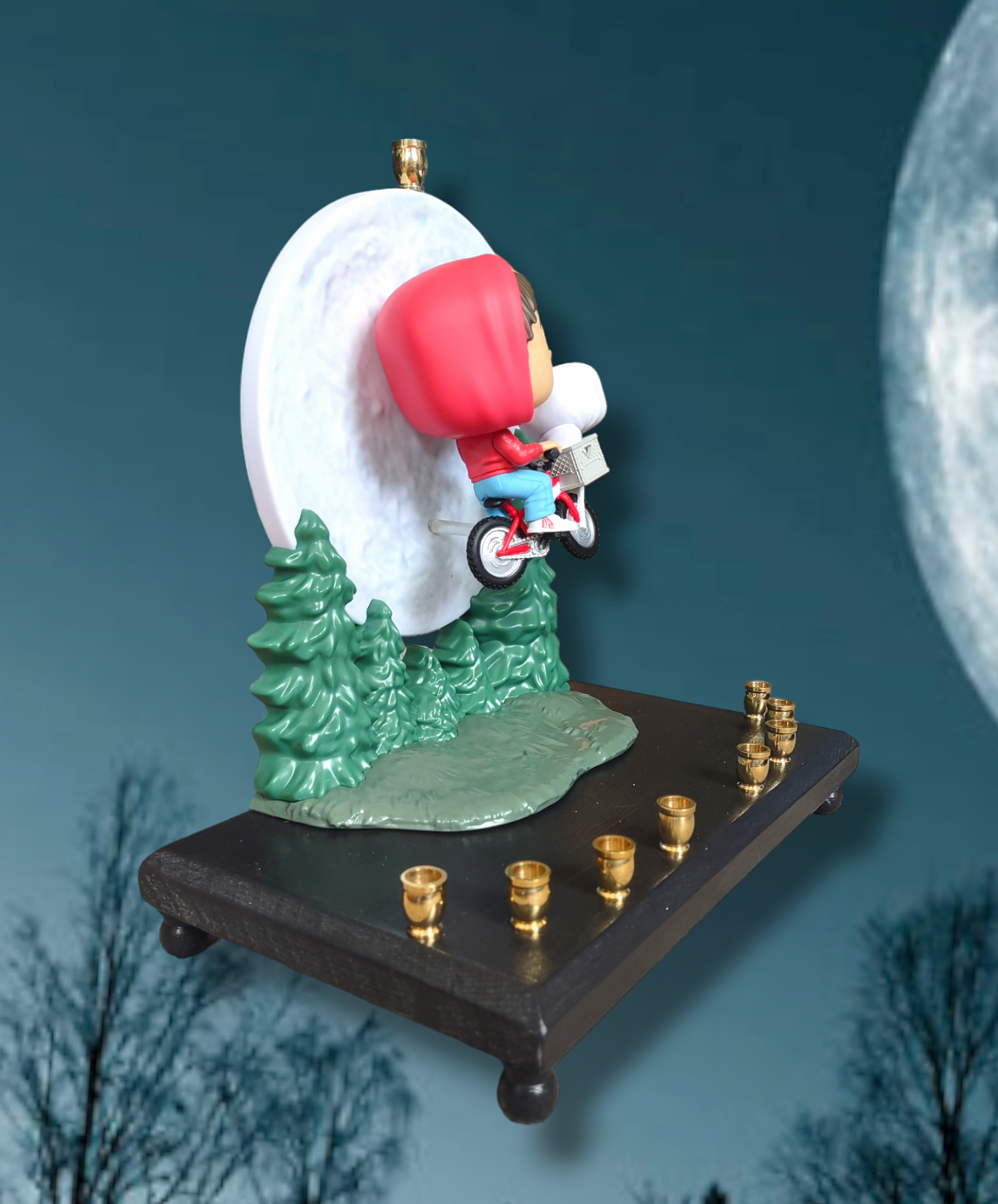 E.T. bike over the moon menorah — collectible flight scene above the treeline | Judaica Square Lakewood (view 2)