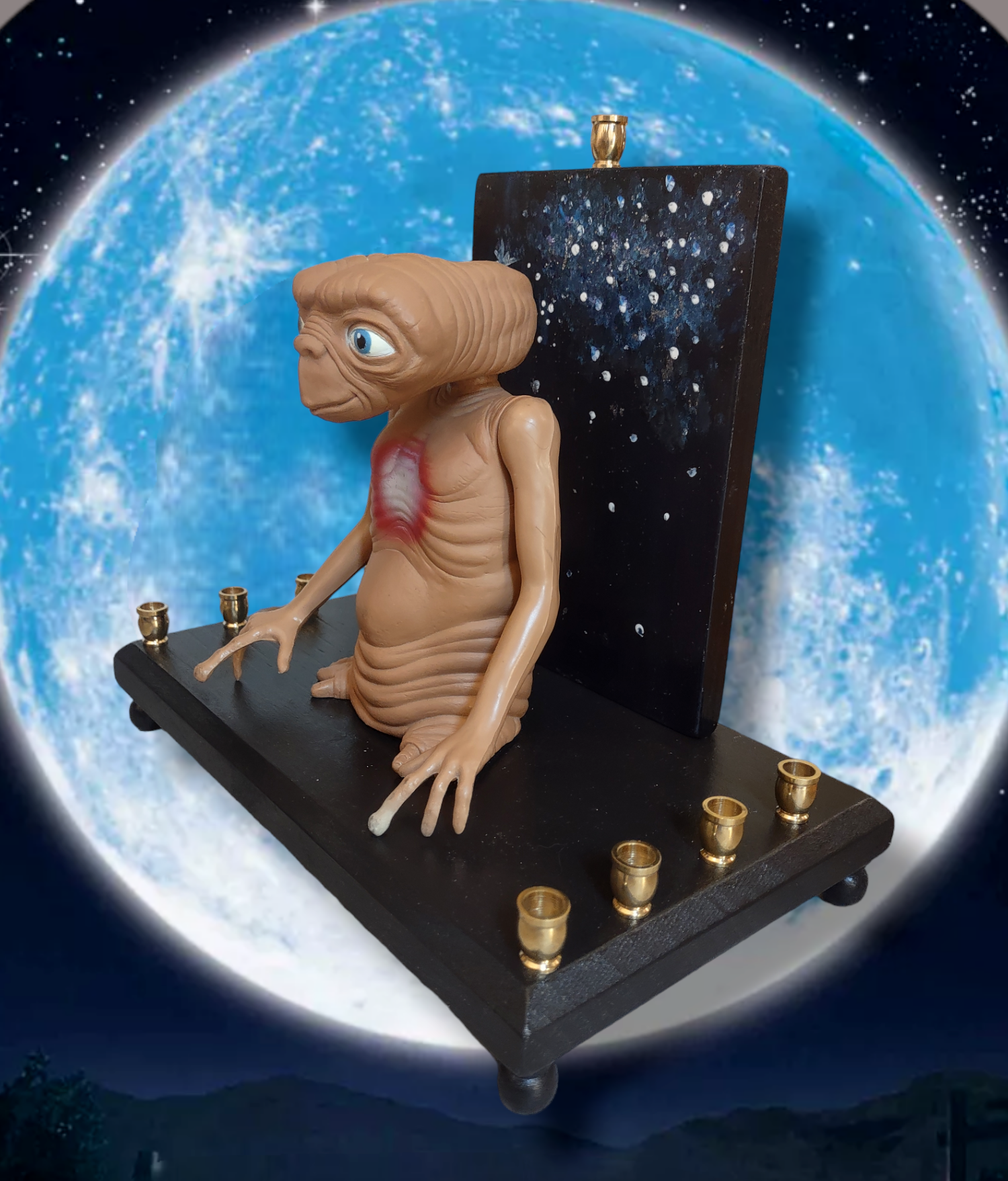 Giant E.T. Menorah — large alien figure above brass candle cups on wood | Judaica Square Lakewood (view 3)