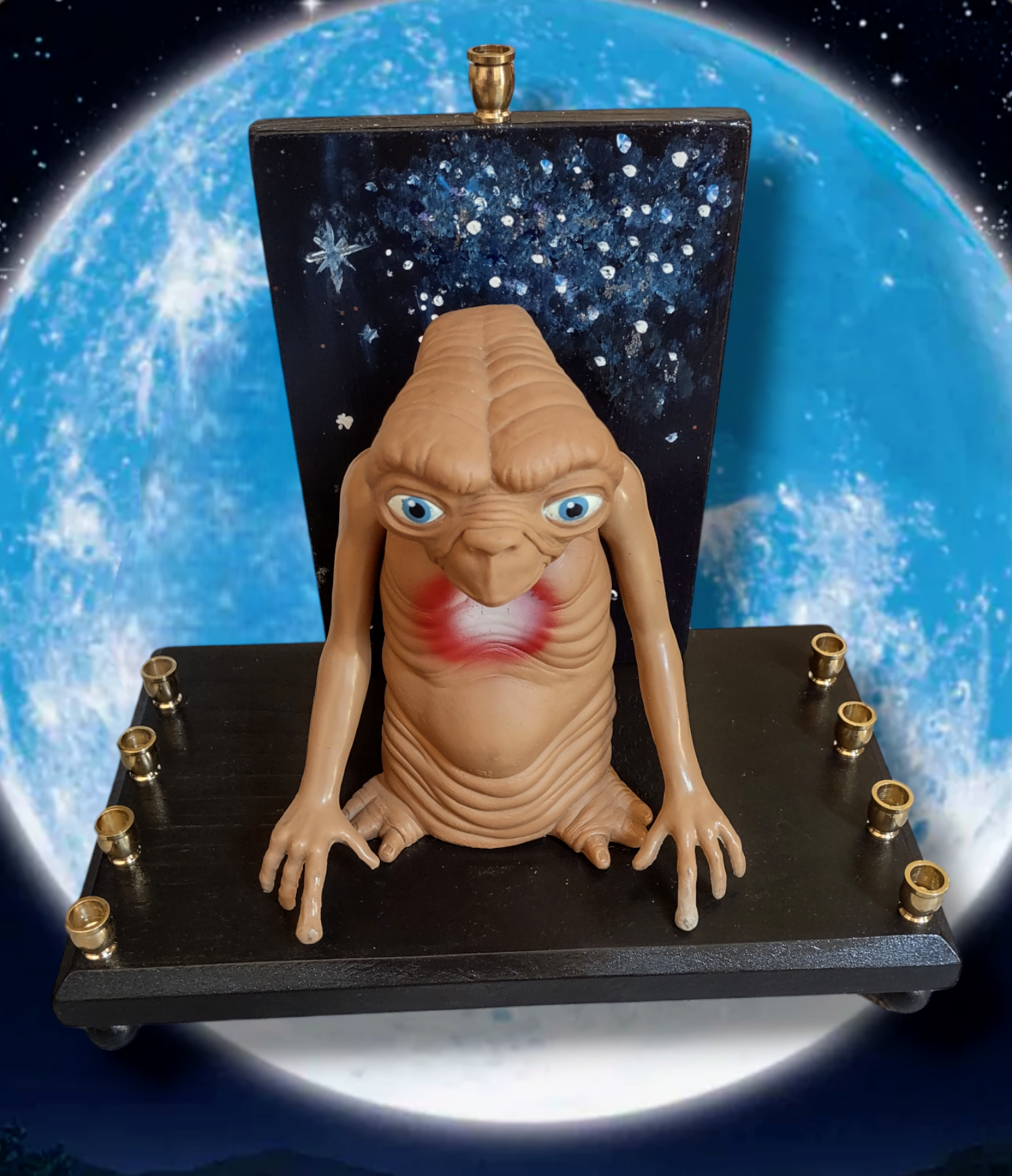 Giant E.T. Menorah — large alien figure above brass candle cups on wood | Judaica Square Lakewood (view 4)