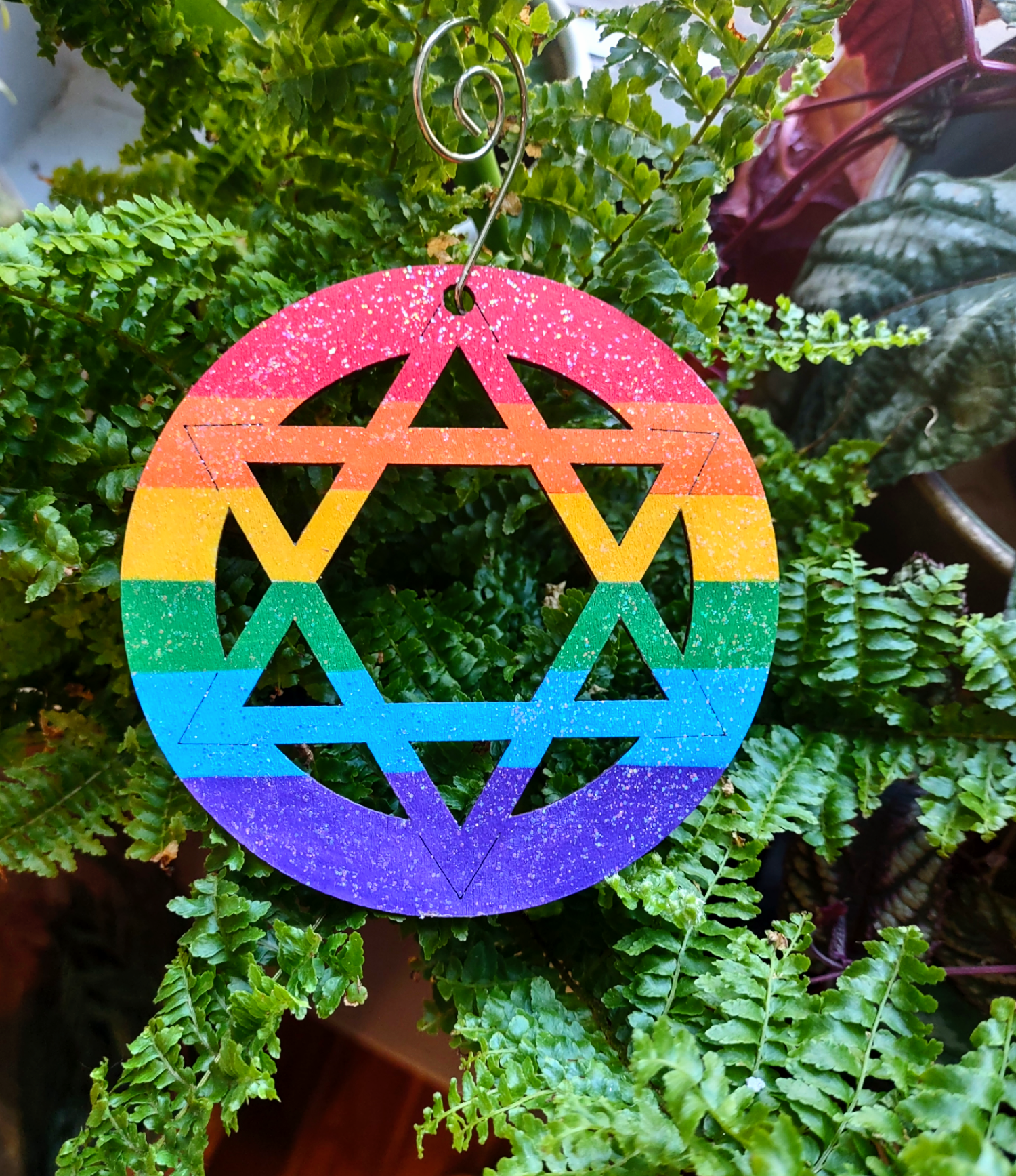 Wooden rainbow star — four-inch glitter-sealed hand-painted ornament | Judaica Square Lakewood (view 2)