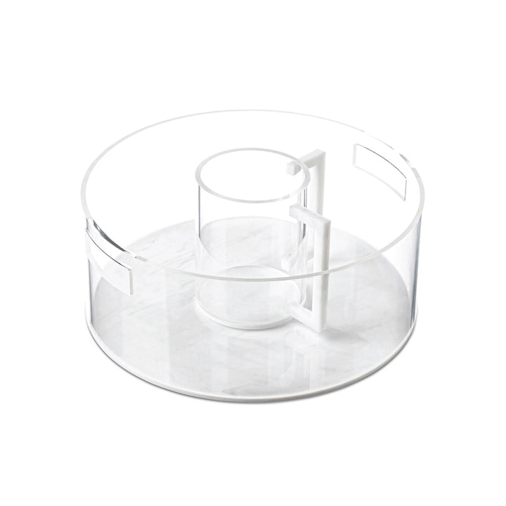 Clear lucite bowl with a white marble base holding the matching washing cup