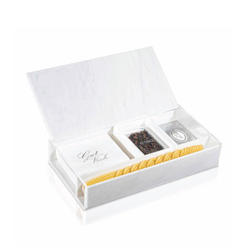 The white marble lucite Havdalah box open, showing the besamim compartment, napkins and candle