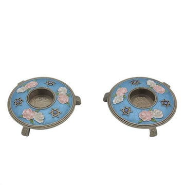 Reuven Masel blue floral candle holders with decorative stars and round bases