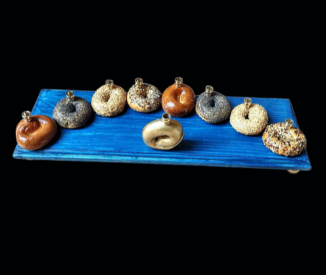 Bagel Lover's Menorah — nine real shellacked bagels on a long stained wood base | Judaica Square Lakewood (view 6)