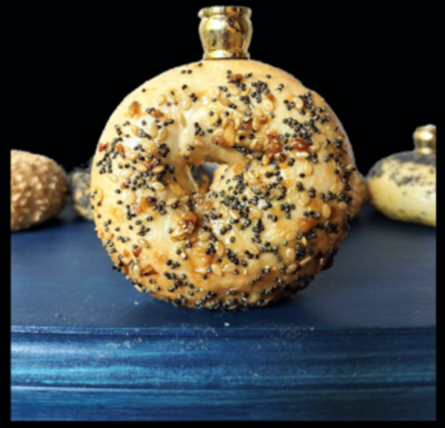 Bagel Lover's Menorah — nine real shellacked bagels on a long stained wood base | Judaica Square Lakewood (view 8)