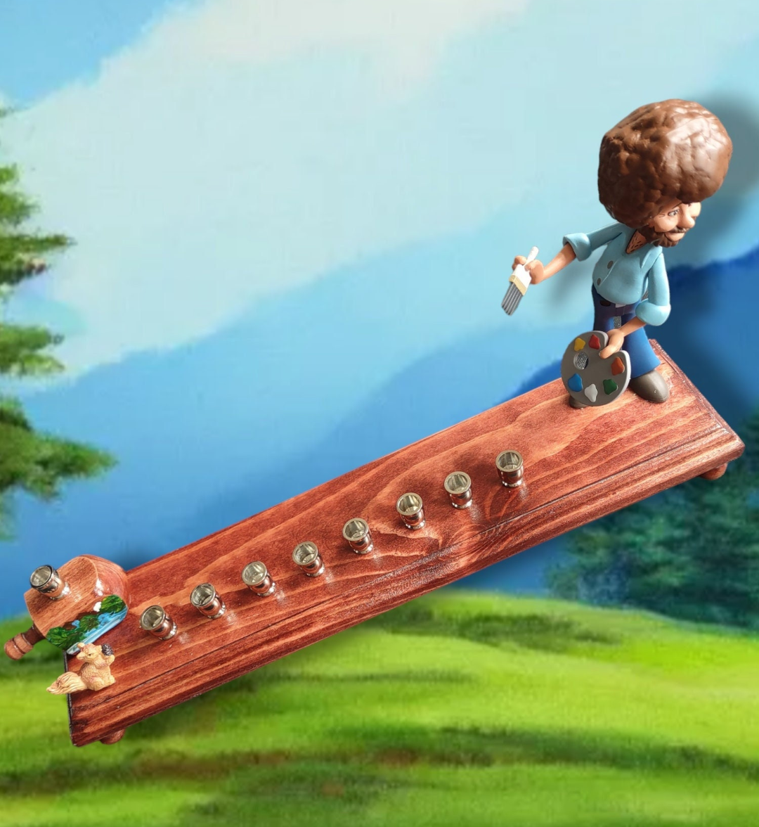 Bob Ross menorah — painter figure with wooden squirrel and nickel candle cups | Judaica Square Lakewood (view 4)