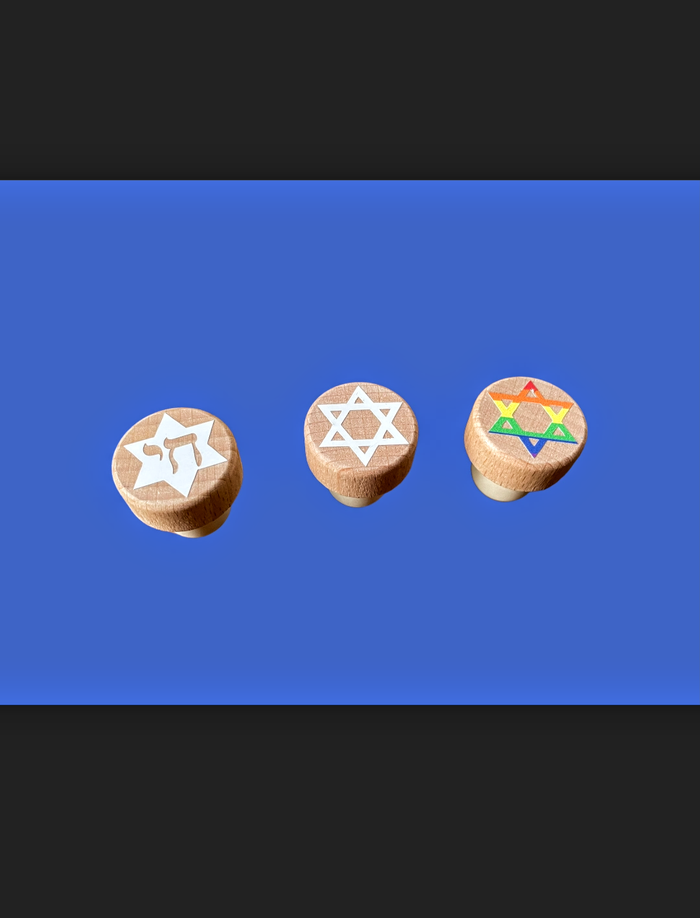 Jewish star and dreidel wine stoppers — wood and cork bottle stoppers with vinyl designs | Judaica Square Lakewood